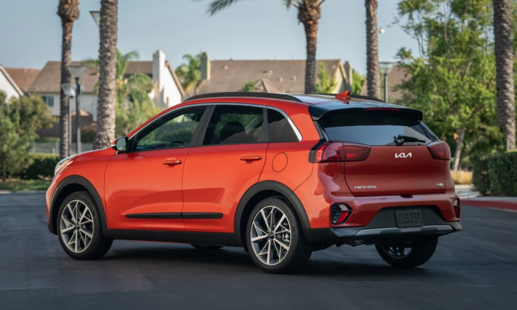 Profile view of a parked, red 2022 Kia Niro. | Kia dealer in Conway, AR.