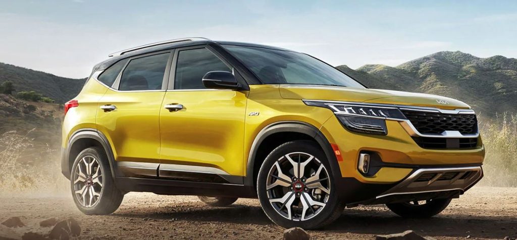 Front profile view of a golden yellow 2022 Kia Seltos parked. | Kia dealer in Conway, AR.