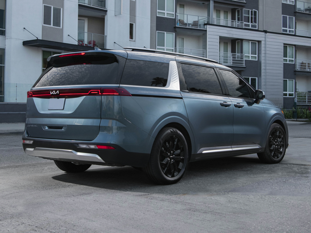 Profile view of a blue 2023 Kia Carnival. | Kia dealer on Conway, AR.