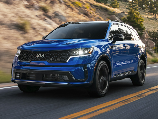 A royal blue 2023 Kia Sorento being driven on the highway. | Kia dealer in Conway, AR.